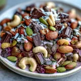 Homemade trail mix with dark chocolate chunks, mixed nuts, and dried apricots—perfect for outdoor adventures or beach days.