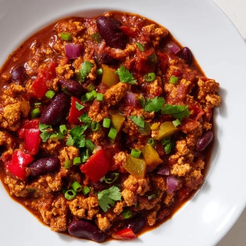 Bright red diced tomatoes and tender turkey simmer in the flavorful turkey chili.