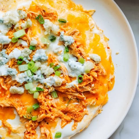 Creamy, spicy Buffalo Chicken Dip with melted cheese, perfect for a game day appetizer.