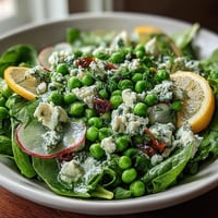 Bright Lemon Vinaigrette Spring Salad with Radishes and Peas - Crisp radishes, sweet peas, and spring greens tossed in a zesty lemon vinaigrette for a refreshing seasonal dish.
